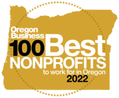 A gold circle with the words oregon business 100 best nonprofits to work for in oregon 2022.