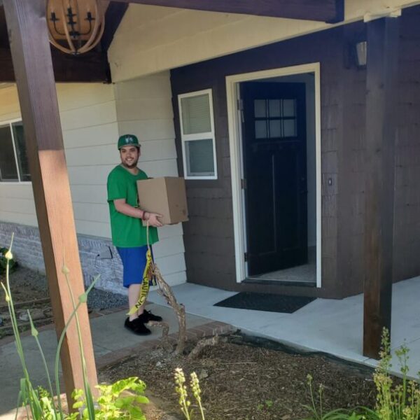 Man carrying box into building